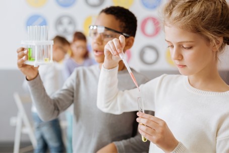 two students working on science project