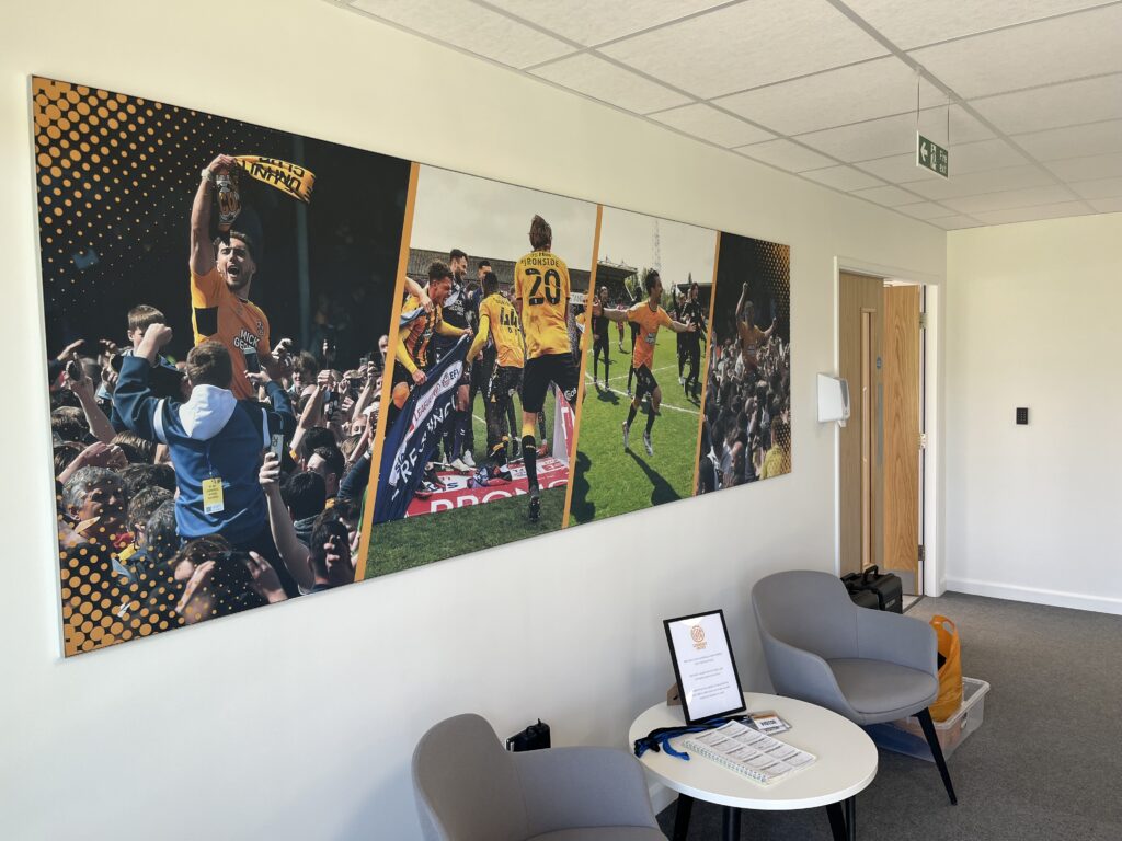 CUFC Training Ground with chairs, table, and photos of players on the wall